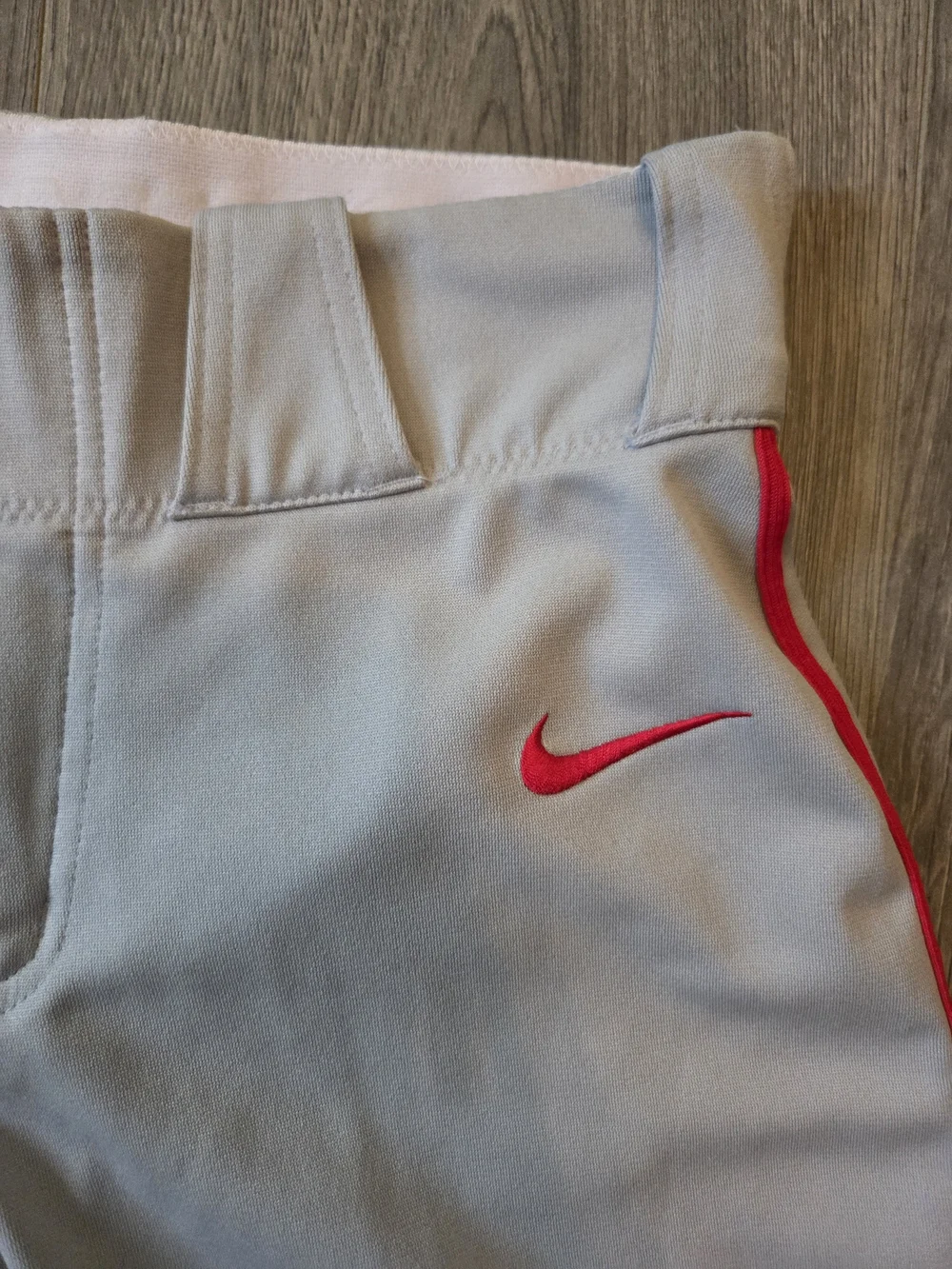 Nike Light Gray Baseball Pants with Red Swoosh Accent